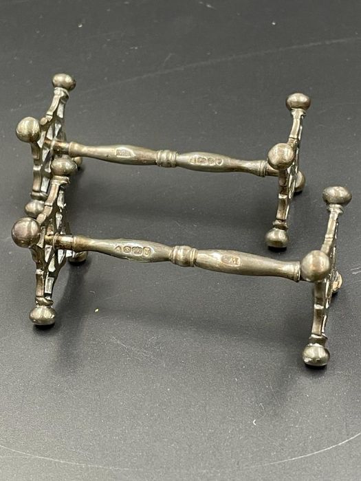 A pair of Georgian silver knife rests, hallmarked for London 1833 by WB
