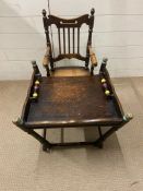 A Victorian child's metamorphic high chair, with turned spindles to back on turned underframe