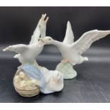 Thee Lladro figures of geese and ducks.