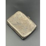 A silver cigarette case by Clark & Sewell, hallmarked for Birmingham 1939