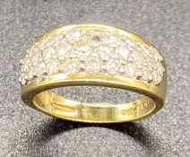 An 18ct gold diamond pave ring (Approx 1 ct diamonds), one small missing stone.