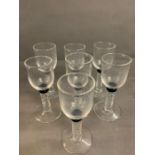 Seven Bell glasses with twisted stem and cobalt blue collar on circular base