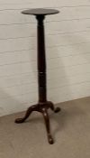 A mahogany plant stand with turned centre pole on tri support legs AF