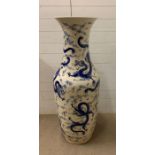 A large floor standing porcelain vase on stand with dragons, measuring (H126cm) without stand