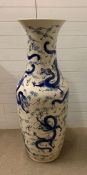 A large floor standing porcelain vase on stand with dragons, measuring (H126cm) without stand