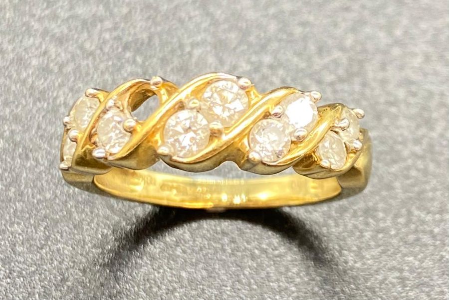 A Diamond ring on an 18ct yellow gold setting, (Missing stone and Total Weight 5.2g)