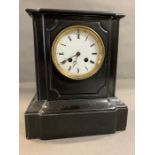 A black slate mantel clock