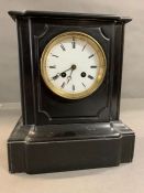 A black slate mantel clock