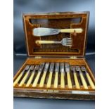 A Walker and Hall silver and bone handled six place setting fish cutlery setting with servers