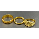 Three 22ct gold rings, two wedding bands and a signet ring (Total Weight 12.2g)
