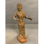 A cast metal sculpture of a lady on wooden base (H44cm arm AF)