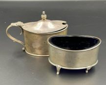 A pair of silver with blue glass lined cruets, mustard and salt, hallmarked for 1923, makers mark