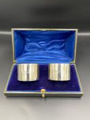 A boxed pair of silver napkin rings by William Hutton & Sons Ltd, hallmarked for Birmingham 1945.