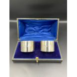 A boxed pair of silver napkin rings by William Hutton & Sons Ltd, hallmarked for Birmingham 1945.