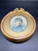 A miniature portrait of a young boy