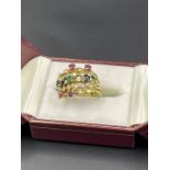 A Russian wedding ring style multiple ring with emeralds, rubies, diamonds and sapphires.(8g)