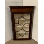 A mahogany wall hanging display cupboard