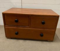 A wooden low chest of drawers (H53cm W90cm D49cm)