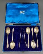 A part set of silver teaspoons and sugar nips (one spoon missing)