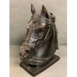 A bronze effect metal horse head sculpture (40cm x 40cm)