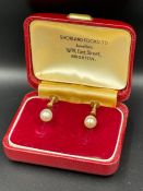 A pair of 9ct gold and pearl earrings