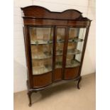 A display case with curved lead glass front and string inlay (H176cm W123cm D32cm)