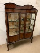 A display case with curved lead glass front and string inlay (H176cm W123cm D32cm)