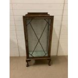 A glazed display cabinet on ball and claw feet and two glass shelves (H130cm W59cm D32cm)