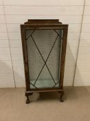 A glazed display cabinet on ball and claw feet and two glass shelves (H130cm W59cm D32cm)
