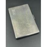 A silver cigarette case, hallmarked for Birmingham 1957 by Harmen Brothers (Total Weight 188g)