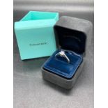 A Tiffany & Co Diamond engagement ring 0.54ct VS clarity and colour F, emerald cut