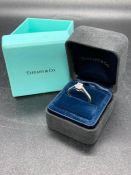 A Tiffany & Co Diamond engagement ring 0.54ct VS clarity and colour F, emerald cut