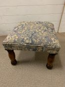 A square upholstered stool on mahogany legs (47cm sq x 34 cm H)