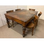 A dining table on turned legs with five bentwood chairs