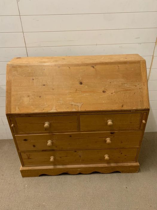 A pine bureau fall opening to an arrangement of drawers, pigeon holes (H107cm W110cm D44cm) - Image 2 of 4