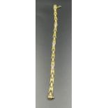 An 18ct gold and diamond bracelet (Total Weight 15.8g)