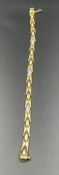 An 18ct gold and diamond bracelet (Total Weight 15.8g)