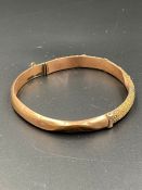 A 9ct gold bangle AF (Total weight 6.4g)