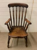 A high back spindle farmhouse chair