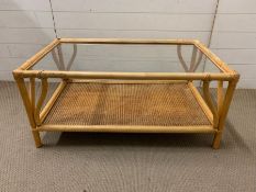A bamboo glass and cane coffee table (H47cm W100cm D60cm)