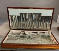 A mahogany cased canteen of cutlery