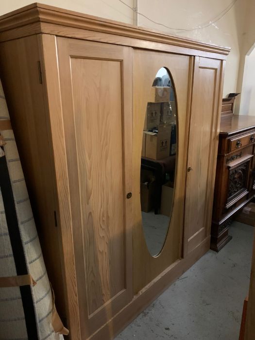 A pine triple wardrobe with hanging rails and shelves to one side (H197cm W179cm D62cm) - Image 2 of 4