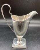 A silver Helmet jug by Robert Hennell 1st, hallmarked for London 1787