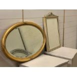 A gilt oval mirror with foxed glass and a painted wall mirror (44cm x 69cm) and (Gilt W86cm)