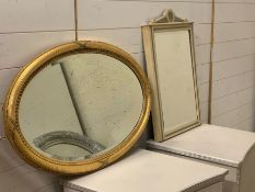 A gilt oval mirror with foxed glass and a painted wall mirror (44cm x 69cm) and (Gilt W86cm)