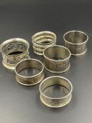A selection of six various silver napkin, rings, various designs and hallmarks (Total weight 90g)