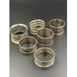 A selection of six various silver napkin, rings, various designs and hallmarks (Total weight 90g)