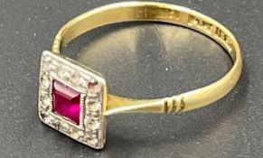 An 18ct gold and platinum ruby and diamond ring (2.1g)