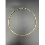 An 18ct gold necklace in white and yellow gold (Total Weight 23g)