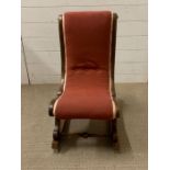 A mahogany frame low rocking chair
